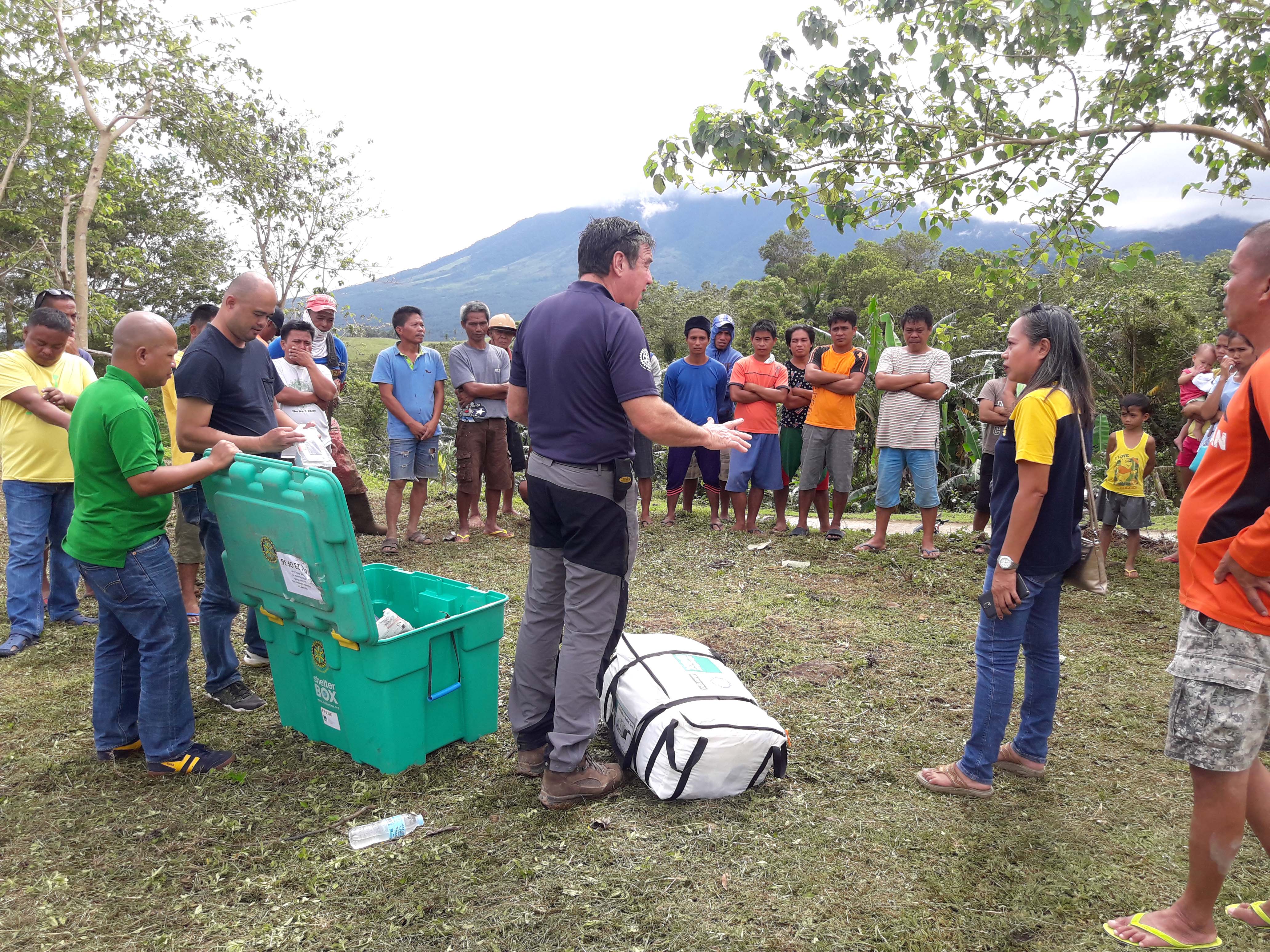 A rotary member showing the contents of a Shelter Box and explaining our aid