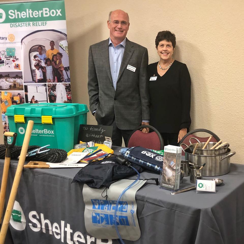 Peggy and Malcolm display Peggy and Malcom at their exhibit showing Shelter Box and other aid items