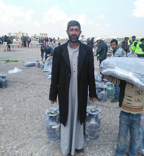 Iraqi Man with water tanks