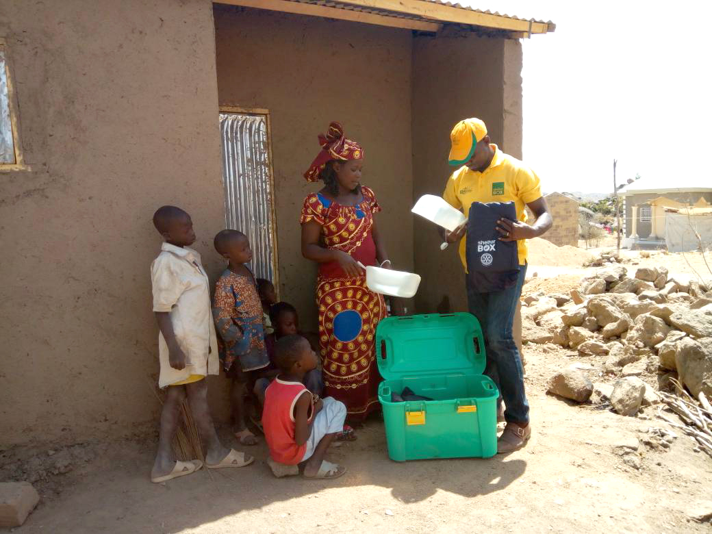 Catherine receiving her ShelterBox