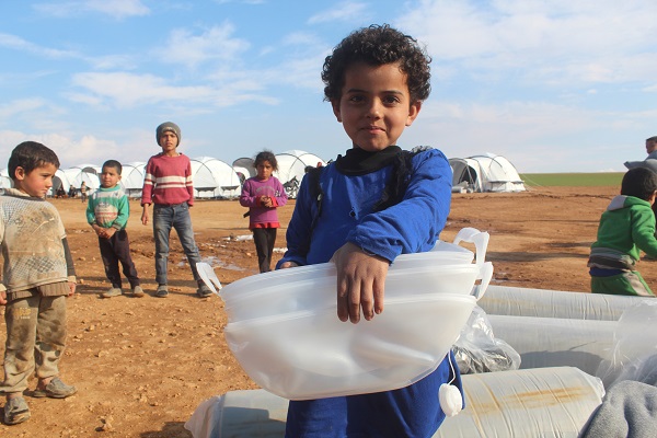 Syrian Boy with water filters