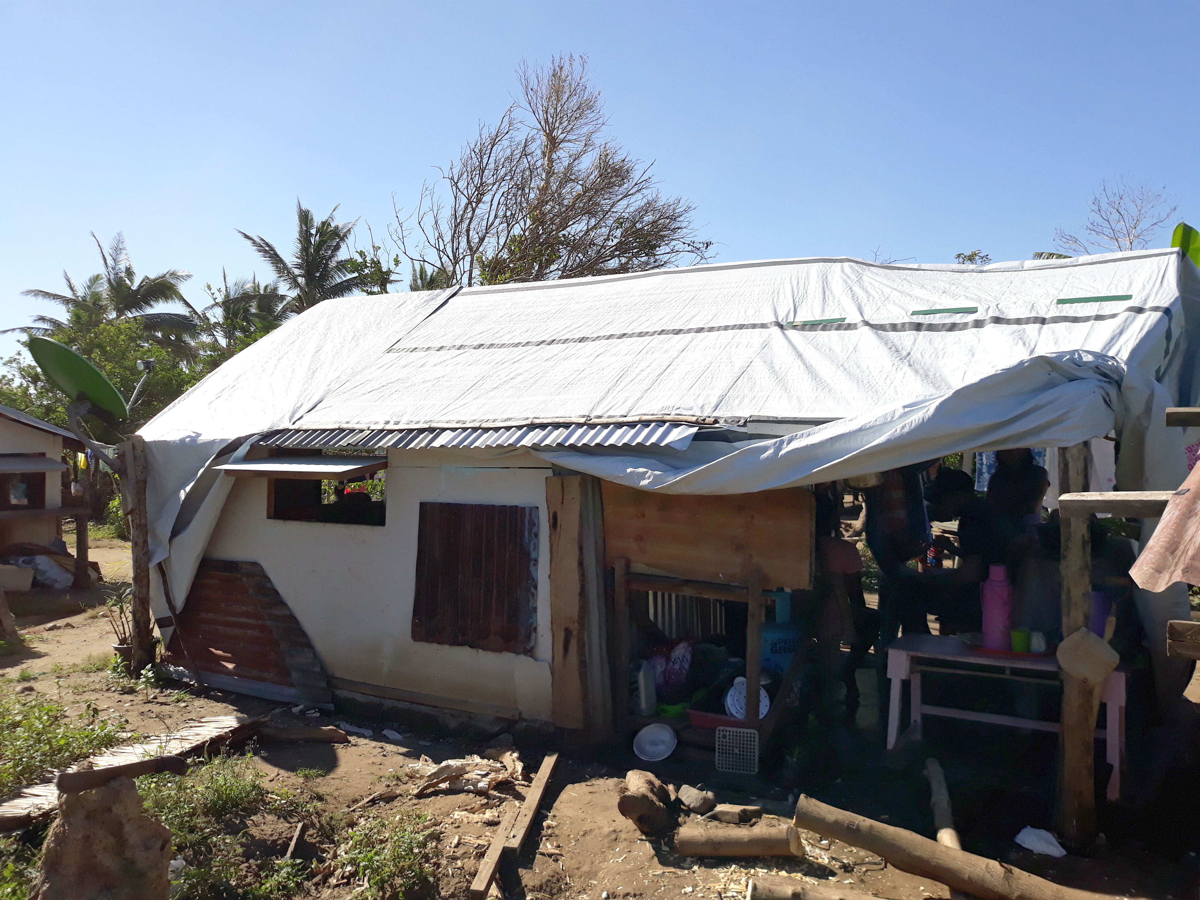 Melody's Home reinforced by the ShelterBox tarpaulin