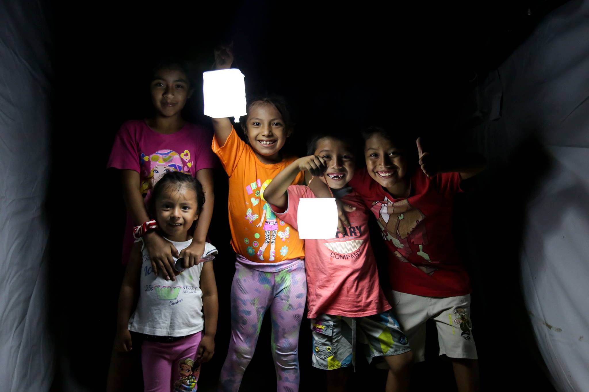 Kids lighting up the night with LuminAid