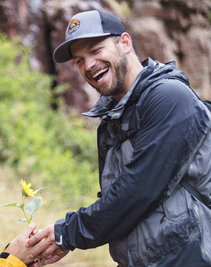 Josh laughing as he and Kara share a moment