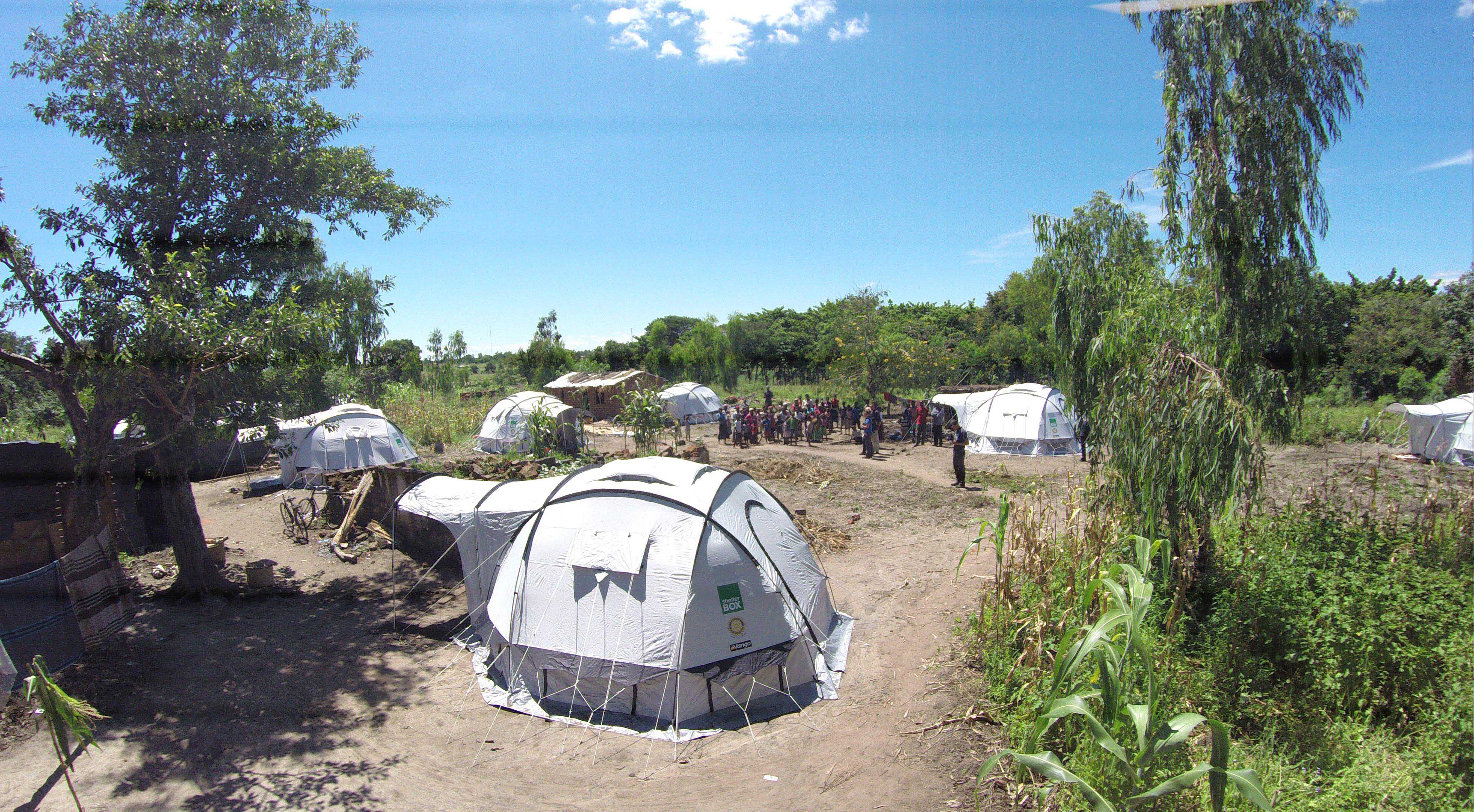 Tents in a field on a bright day in Malawi