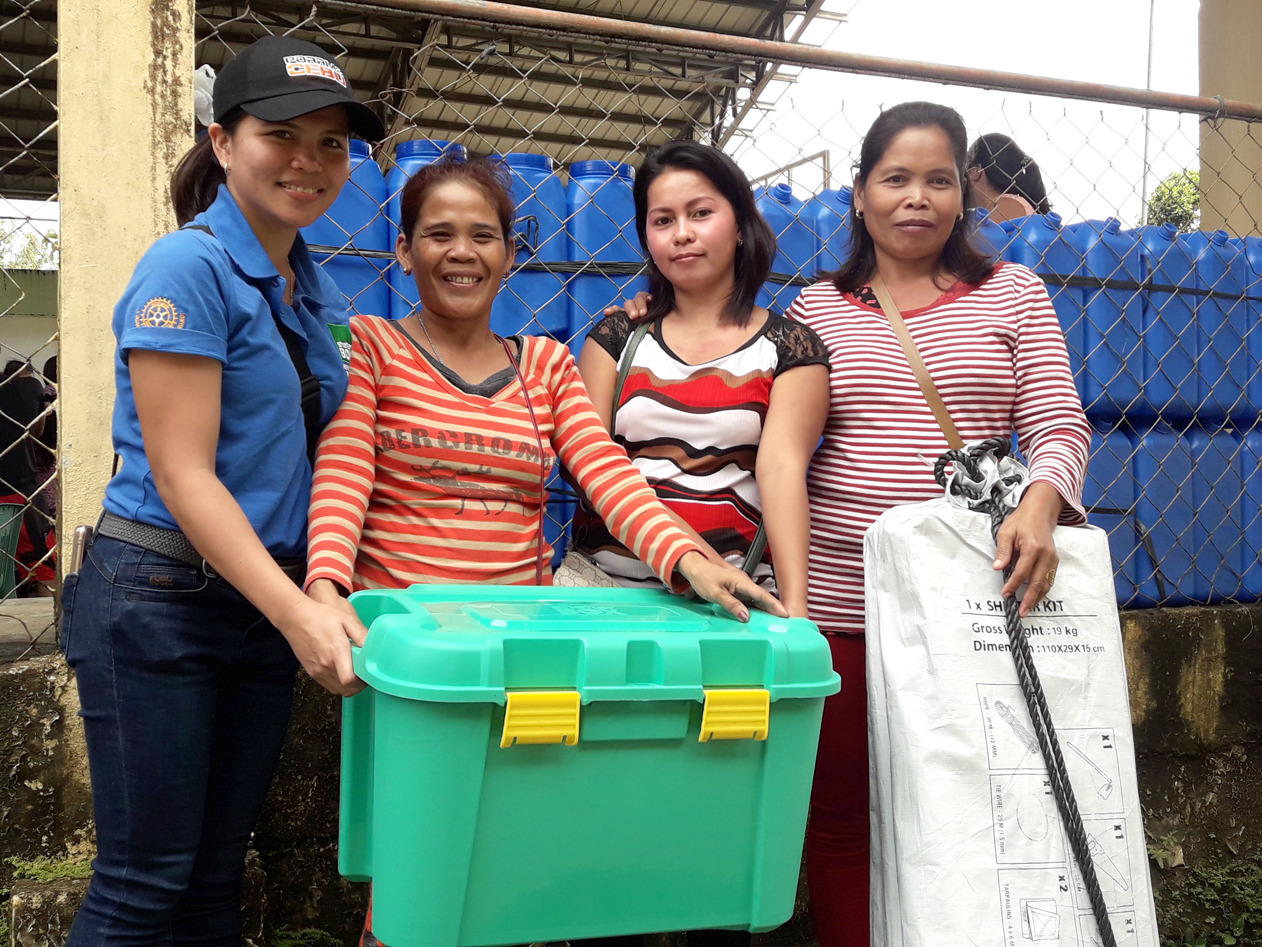 Local rotarians giving out ShelterBoxes