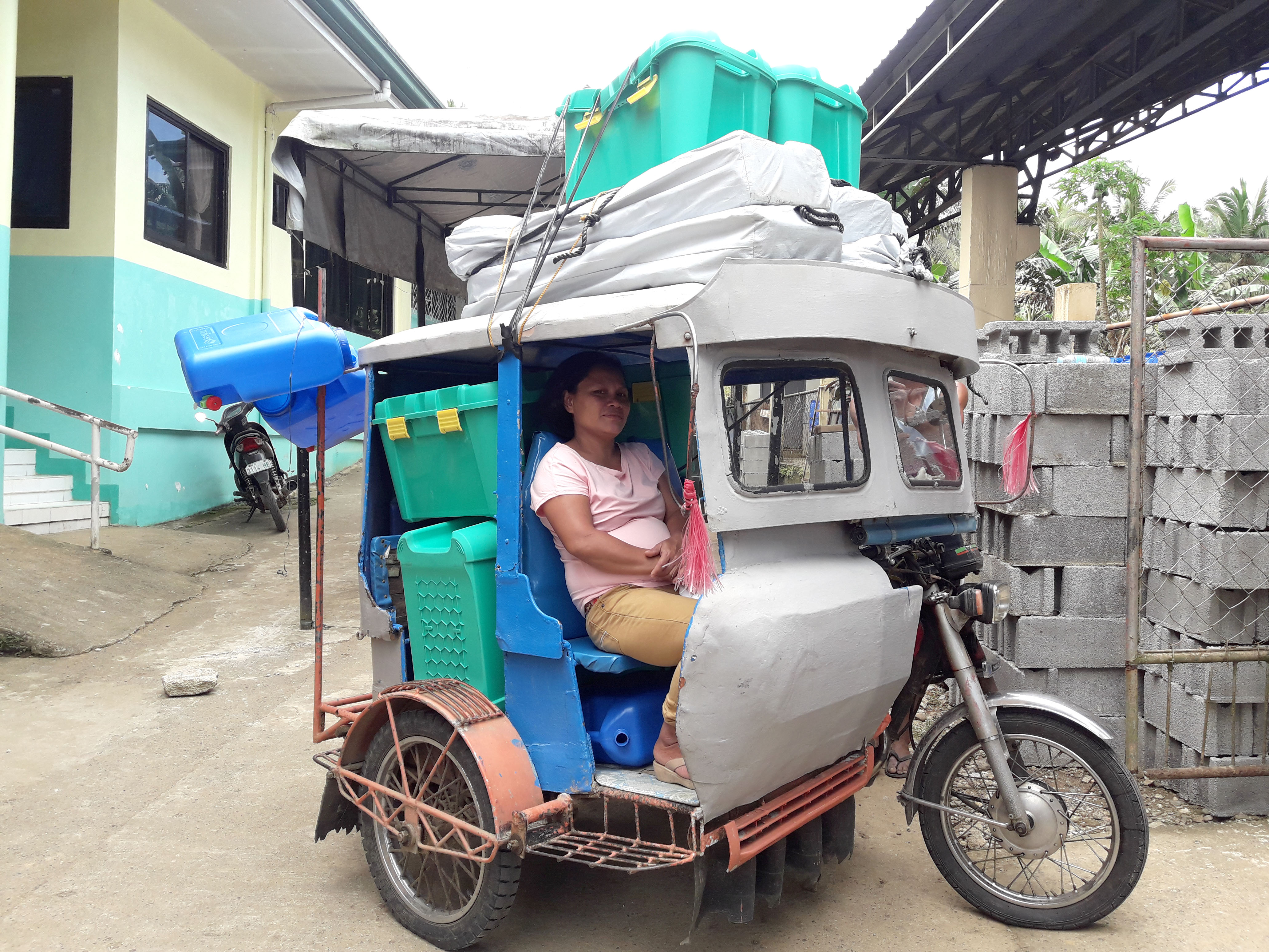Small 3-Wheeled Tuk-Tuk carrying 3 Shelter Boxes