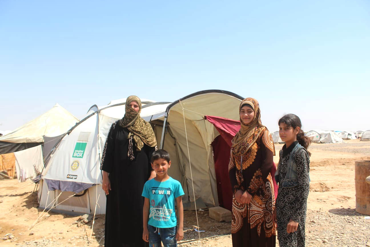 SB_Syria_Asmahan_CaseStudy_BaharOrg_2018_04 Asmahan and her family standing outside their new home.