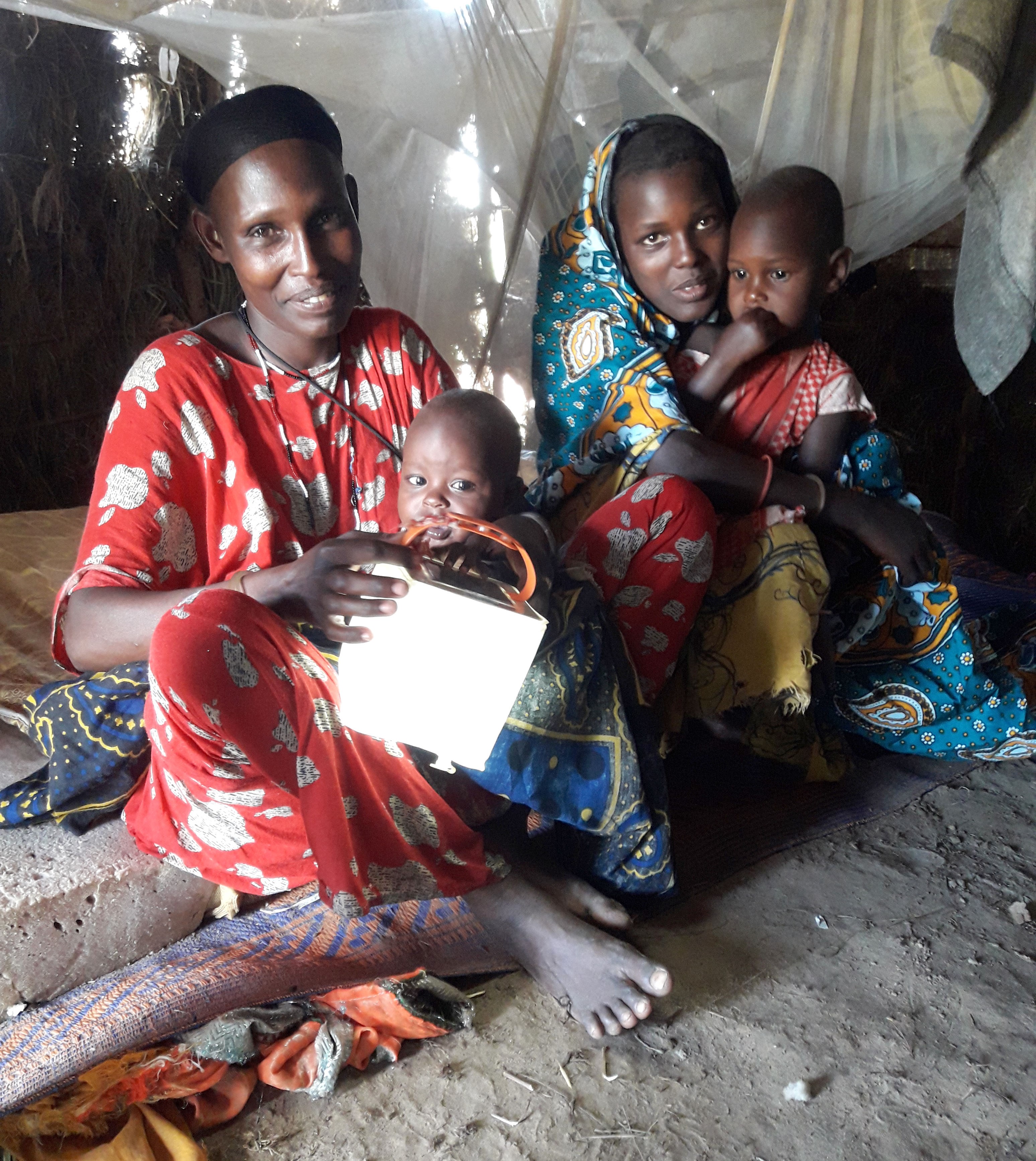 Mariam and friend with children