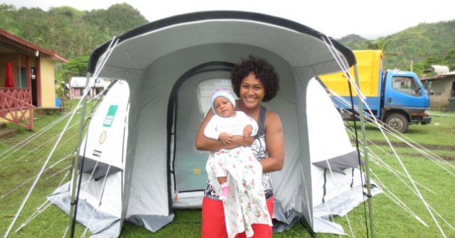 Diane and Yokimi outside tent in Fiji