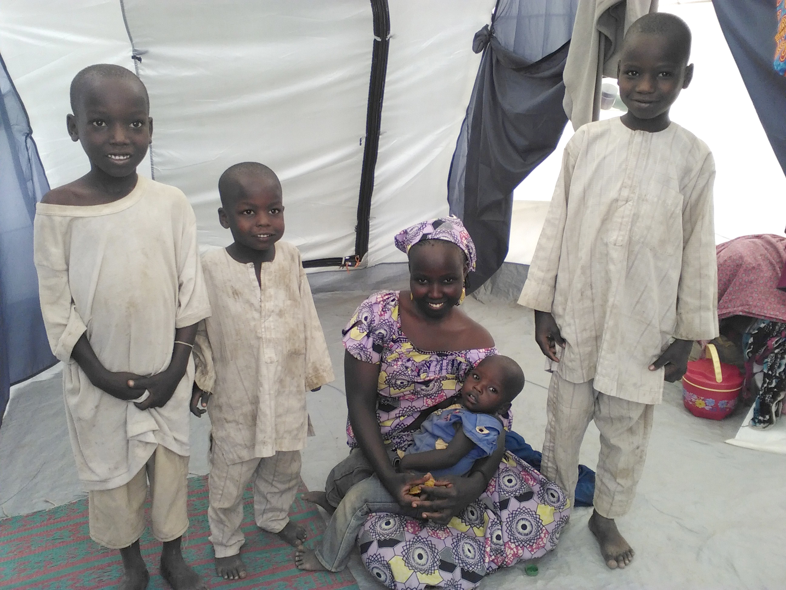 Modu and her four children pose for a family photo