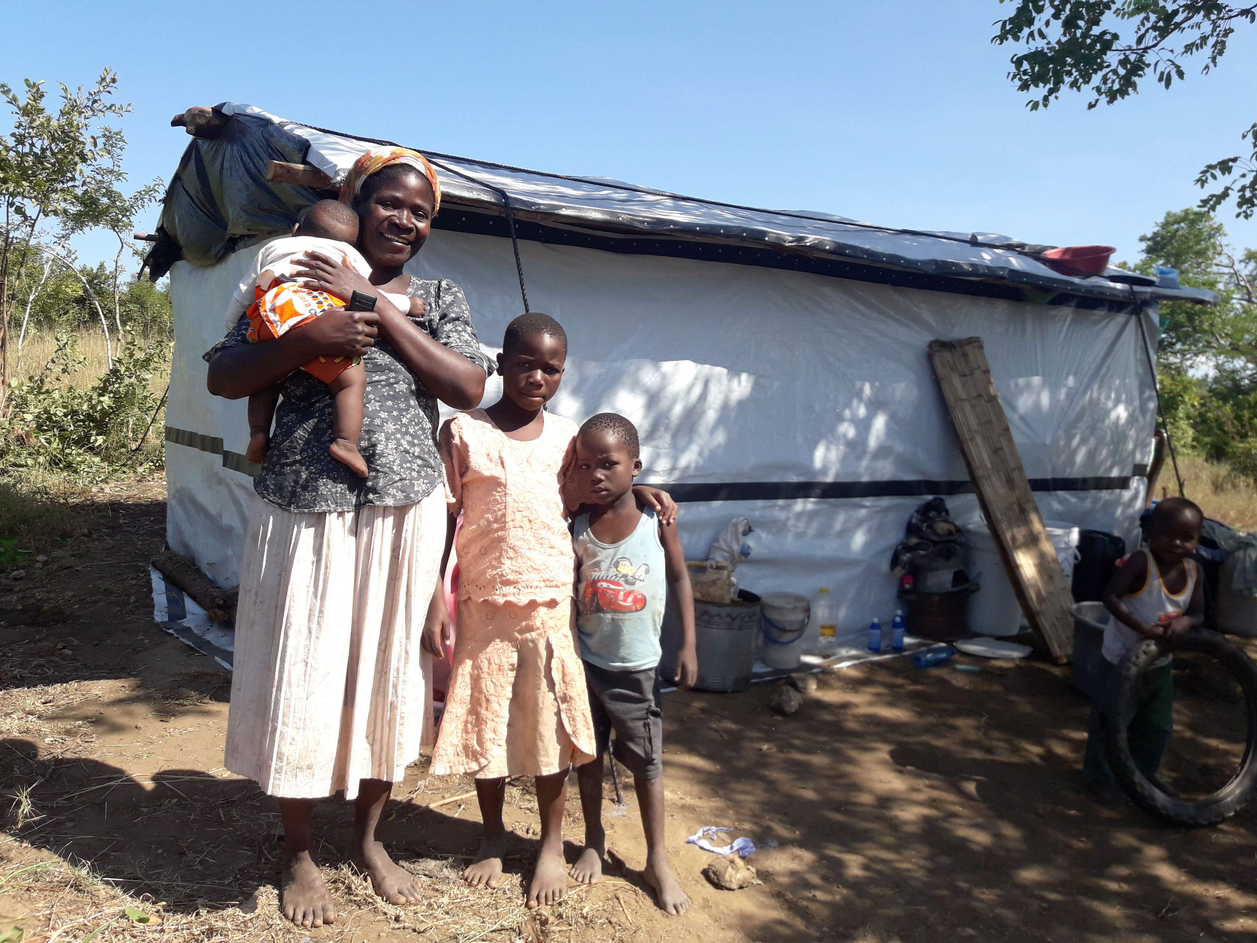 Grace and family outside their home