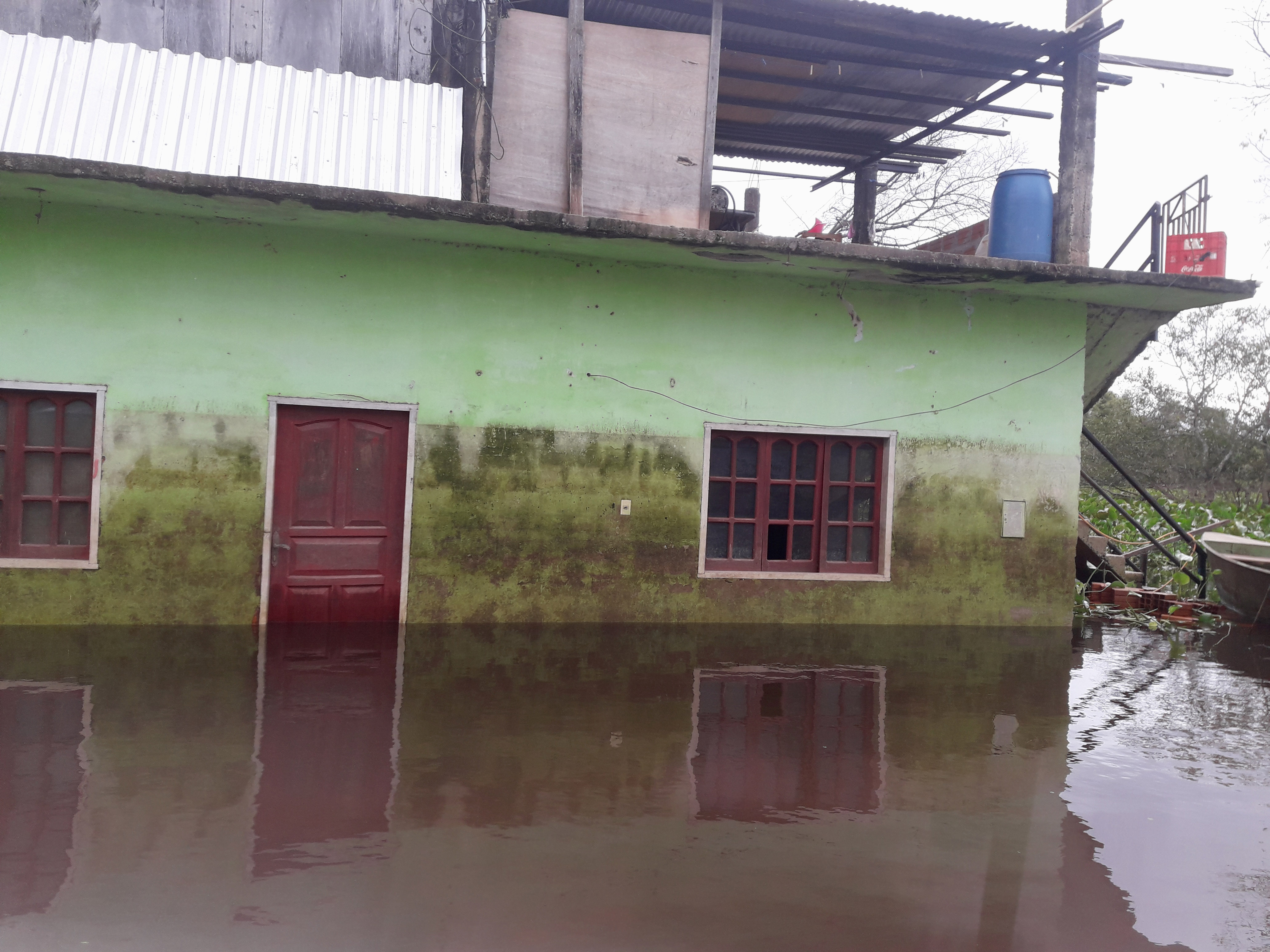 Small Building standing in thigh-high water