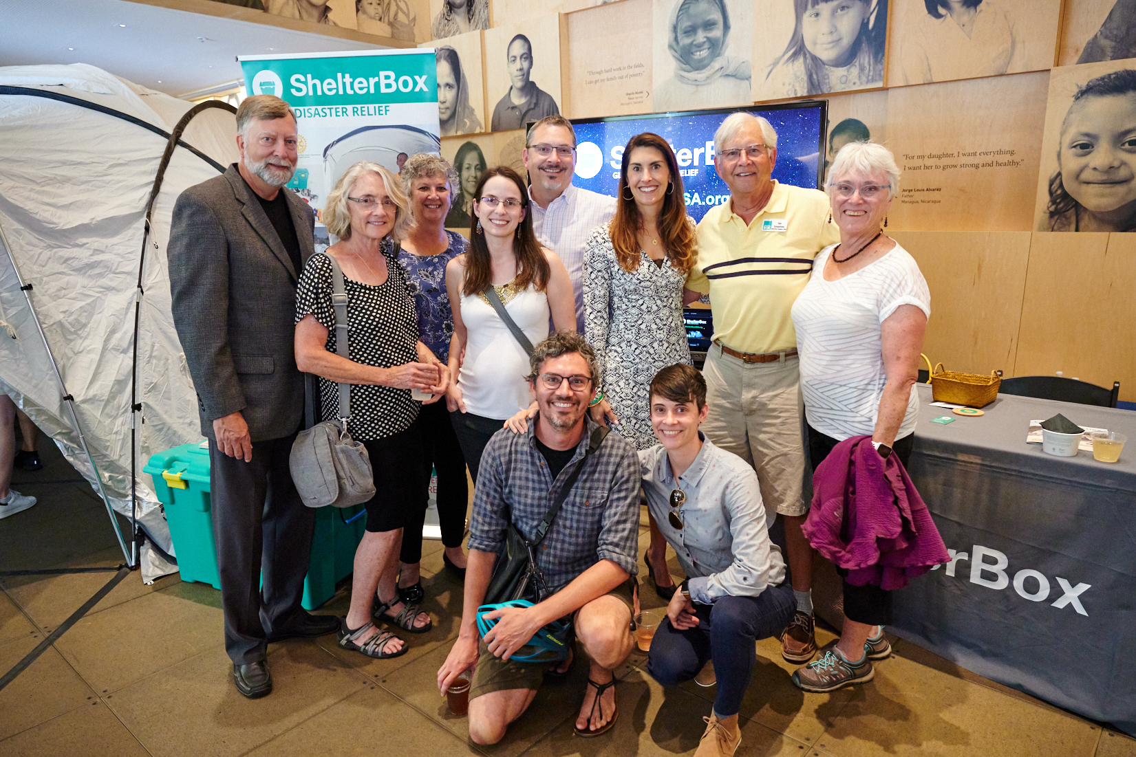 ShelterBox Team standing proudly in front of their exhibit