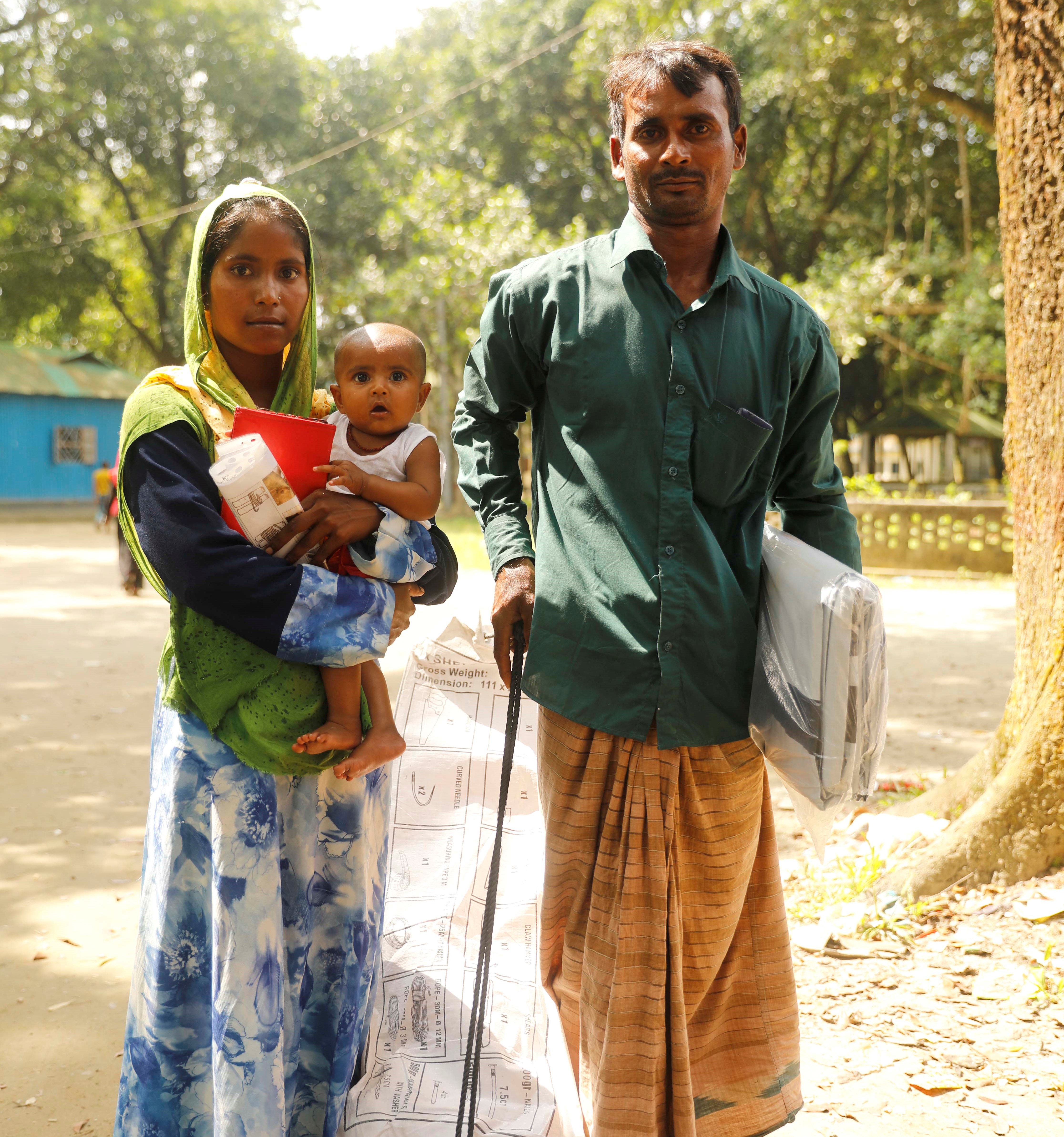 Couple with child and aid items