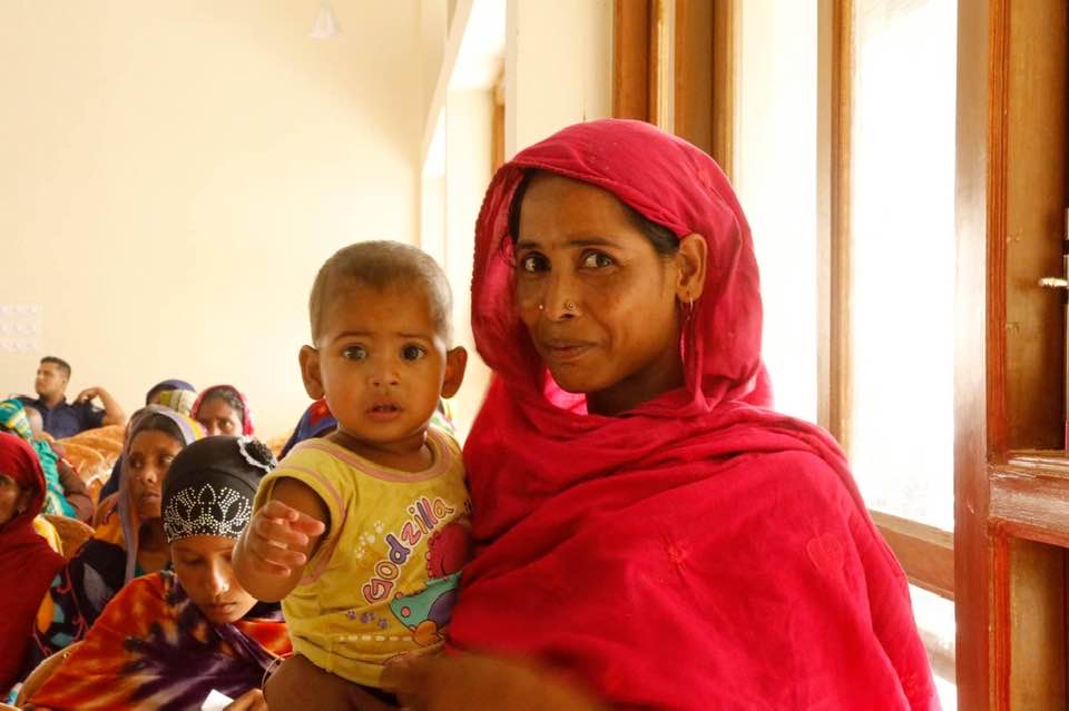 Bangladeshi woman holding her baby