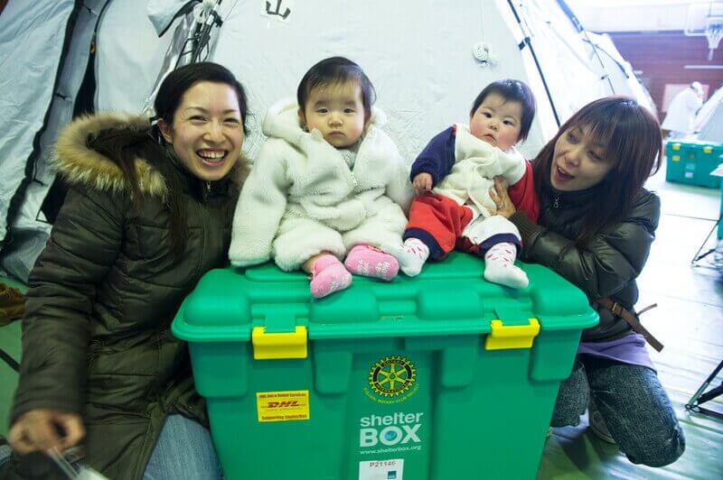 Children on top of ShelterBox