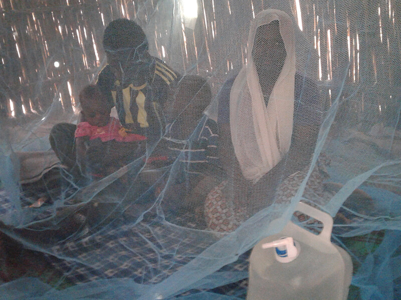 Abdou and his family staying safe under the net