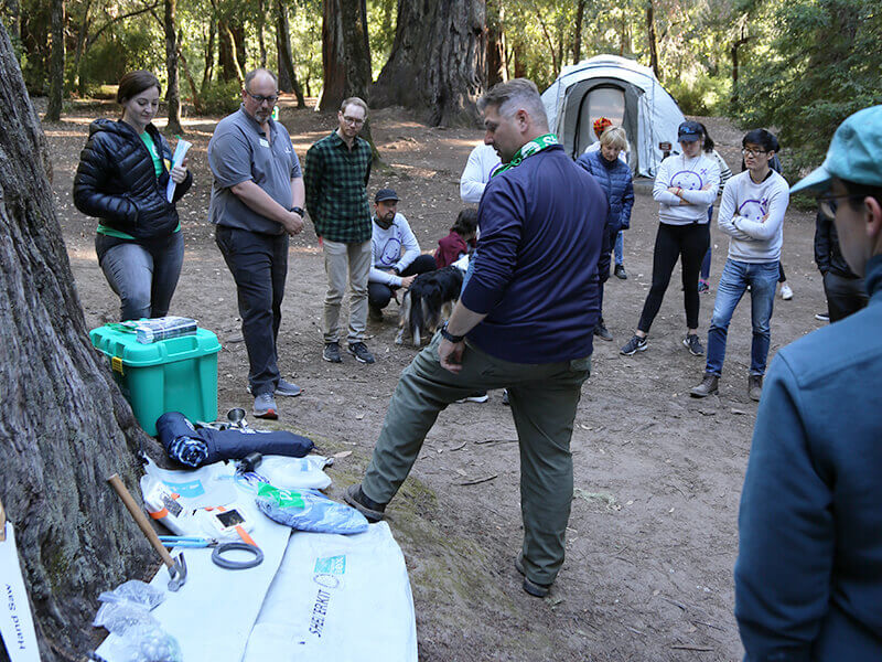 Showing the Air BnB team the contents of a ShelterBox