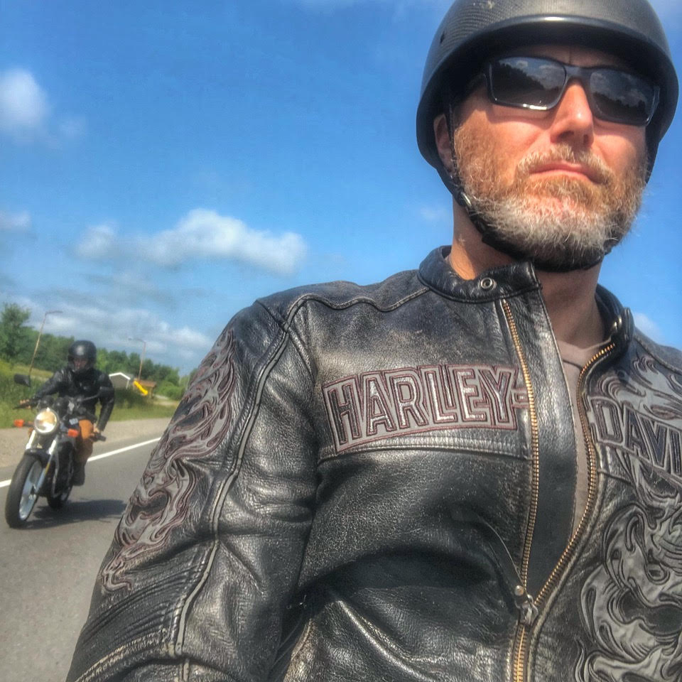 Mark on the road in full biker gear