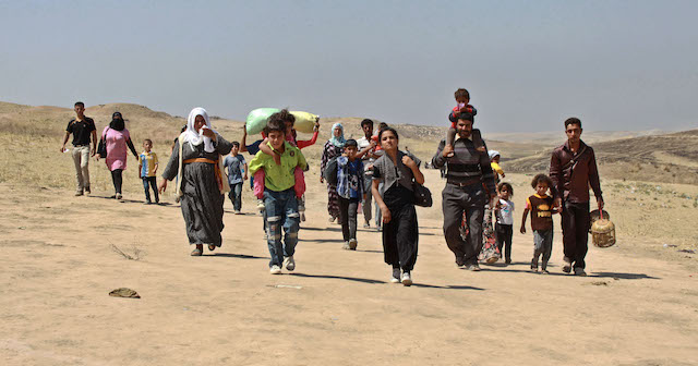 DUHOK GOVERNORATE, IRAQ: Refugees from Syria arrive in the semi-autonomous region of Iraqi Kurdistan after fleeing fighting which has intensified recently in the Kurdish areas of Syria.