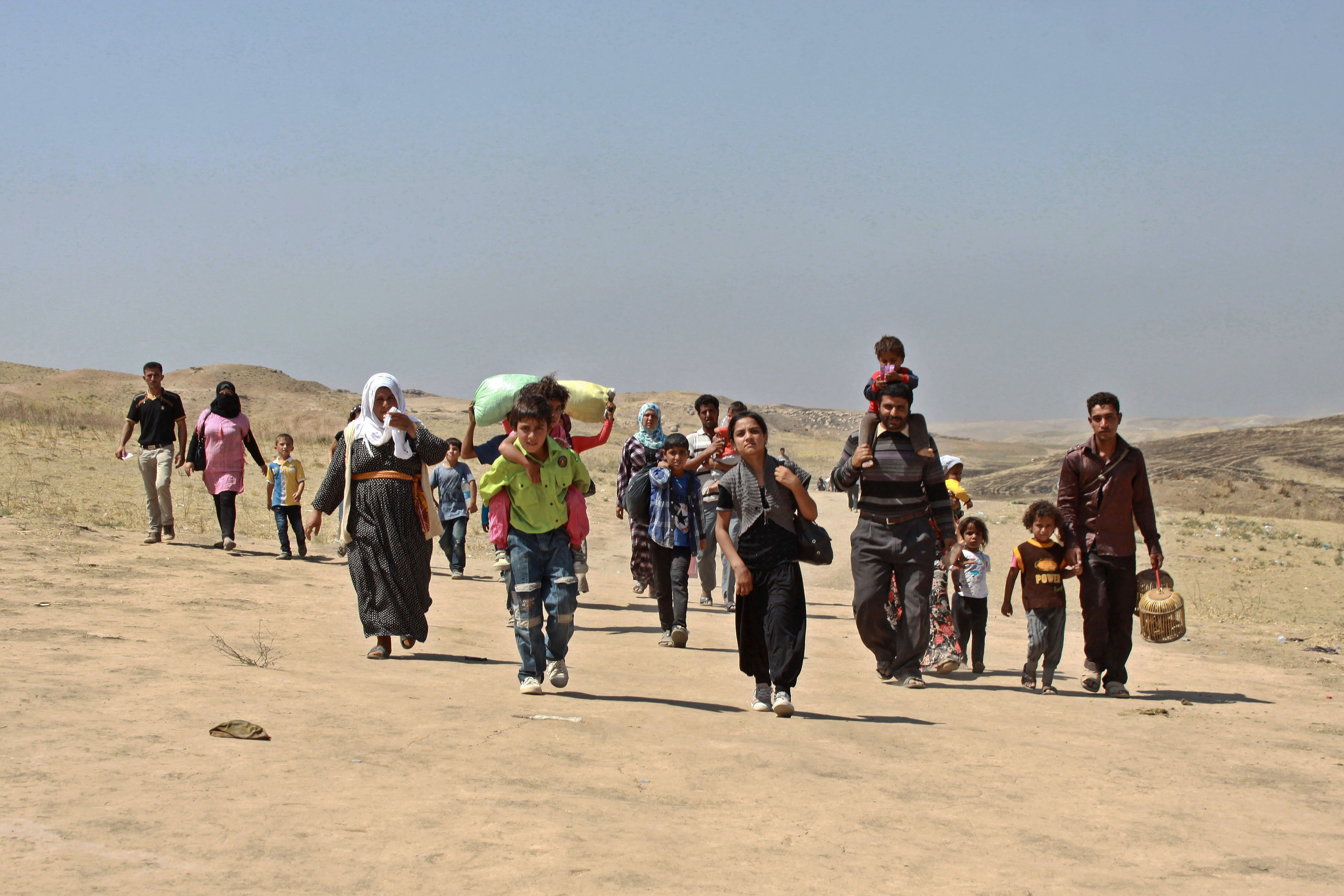 DUHOK GOVERNORATE, IRAQ: Refugees from Syria arrive in the semi-autonomous region of Iraqi Kurdistan after fleeing fighting which has intensified recently in the Kurdish areas of Syria.