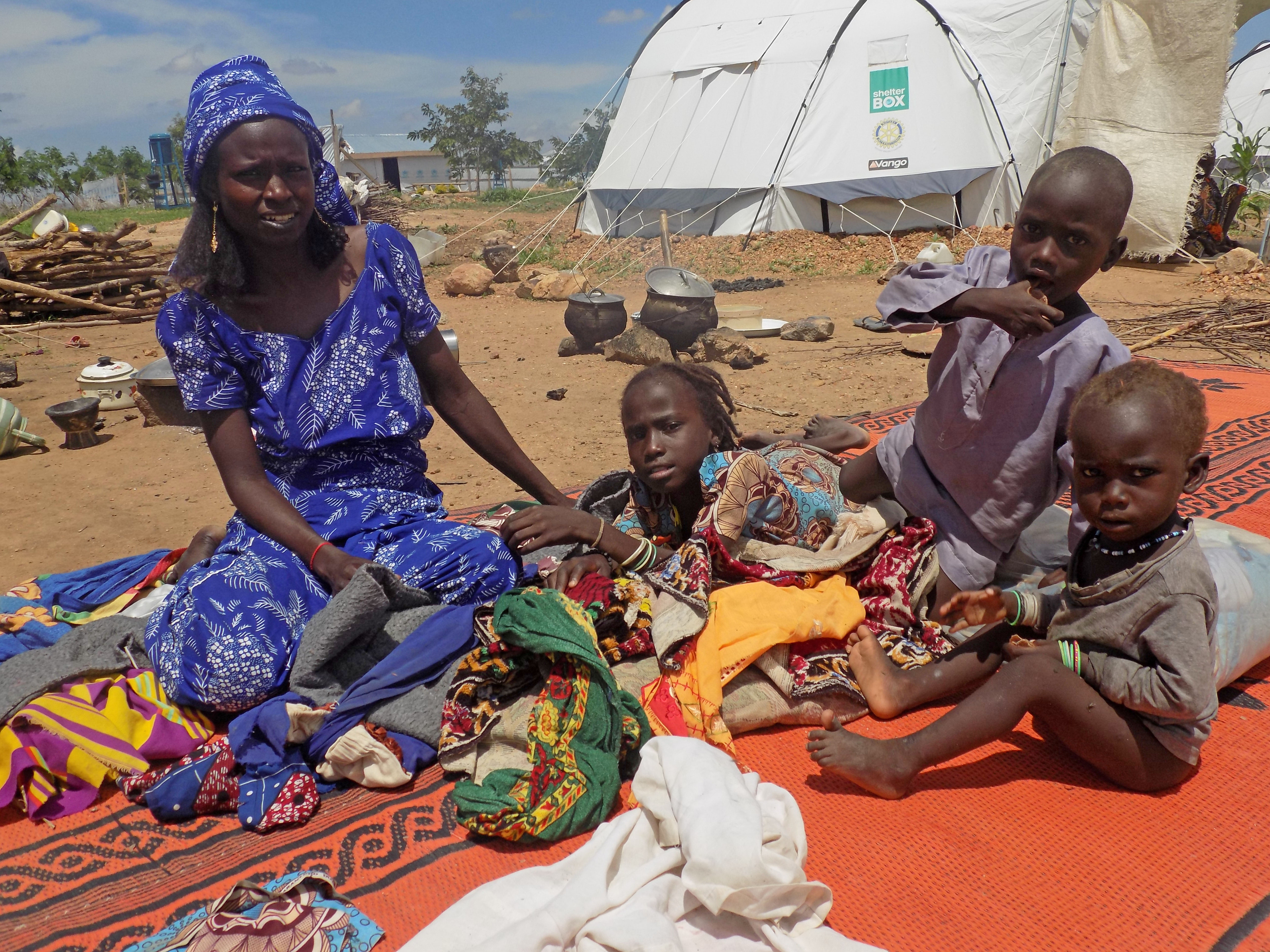 Fanne in front of her tent where she built an entrace