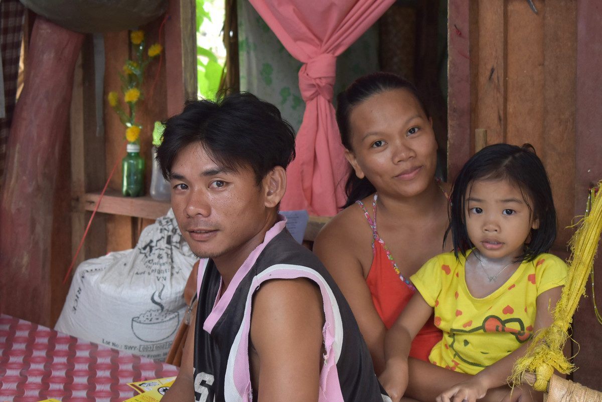 Family poses following Typhoon Vongfong