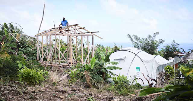 A man begins to rebuild his home on Dominica with support from ShelterBox, 2018