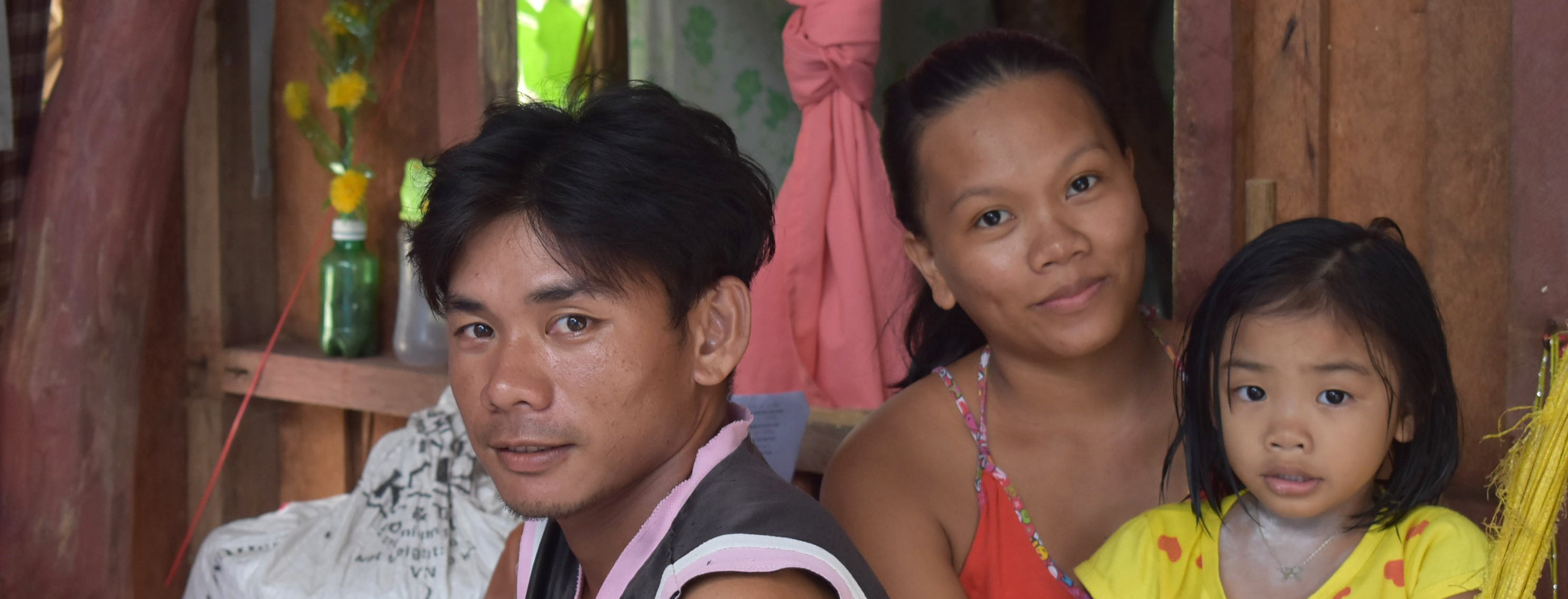 Alejandro, his wife, and daughter after Typhoon Vongfong
