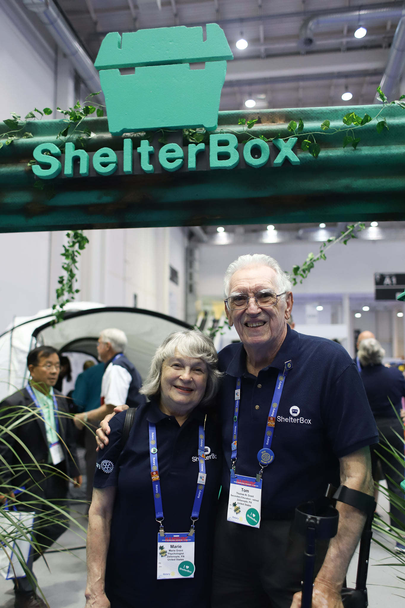 Picture of Tom and Marie Grant at a convention in their ShelterBox gear.