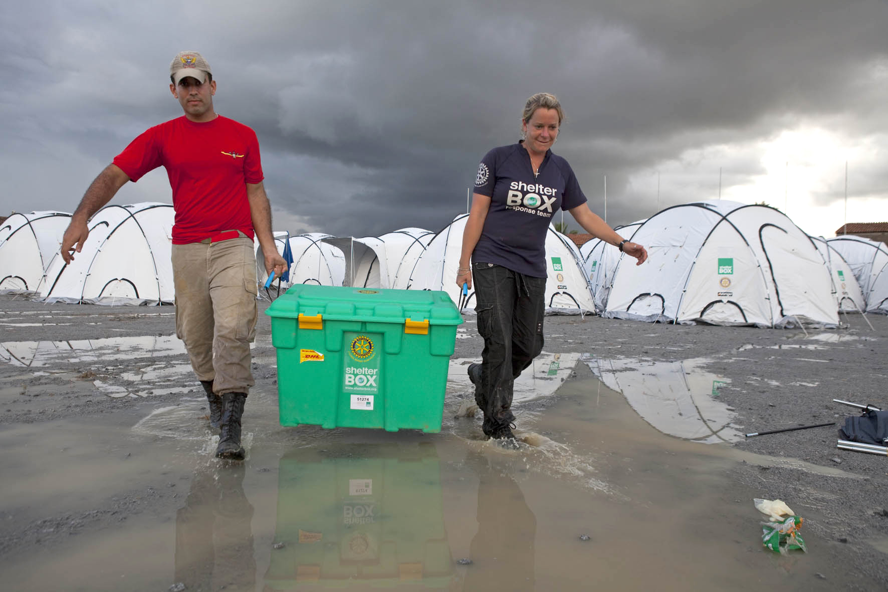 SRT Jodie Hurt (UK) with a Brazilian at Shelterbox camp at Uniao Dos Palmares, Alegoas, Brazil