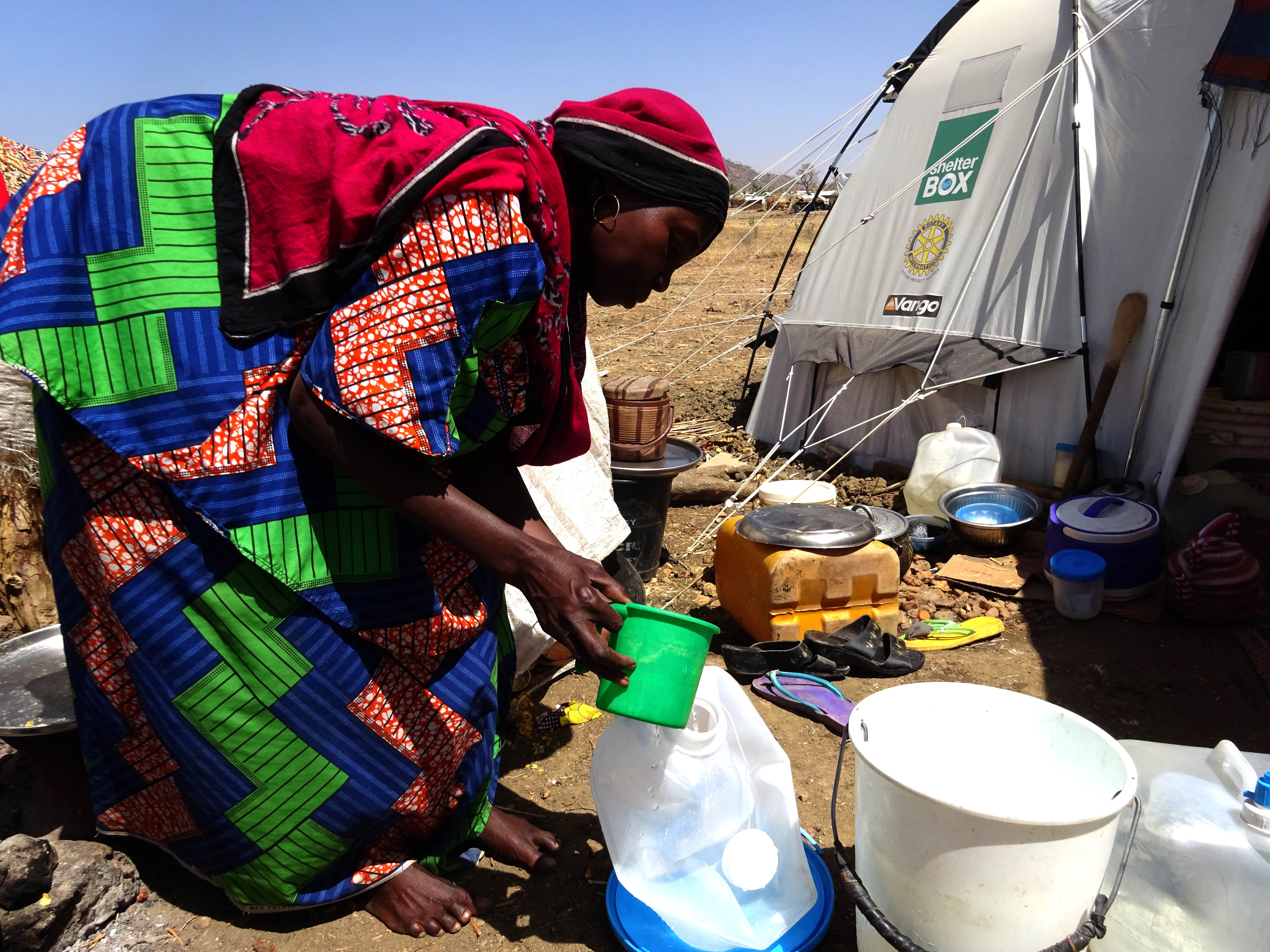 Falmata filters water using a carrier provided by ShelterBox