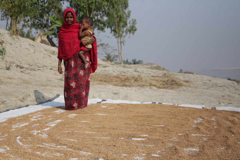 Behula drying seeds on the tarpaulin