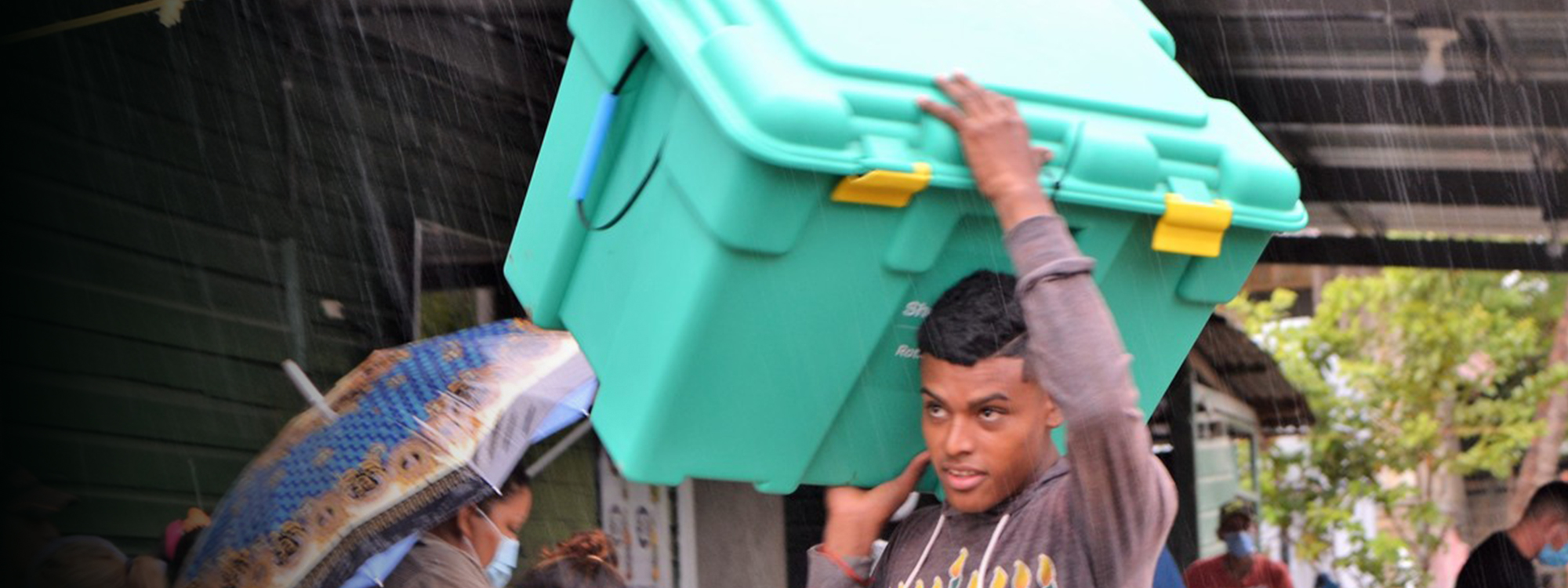 Carrying Shelterbox in the rain, Honduras