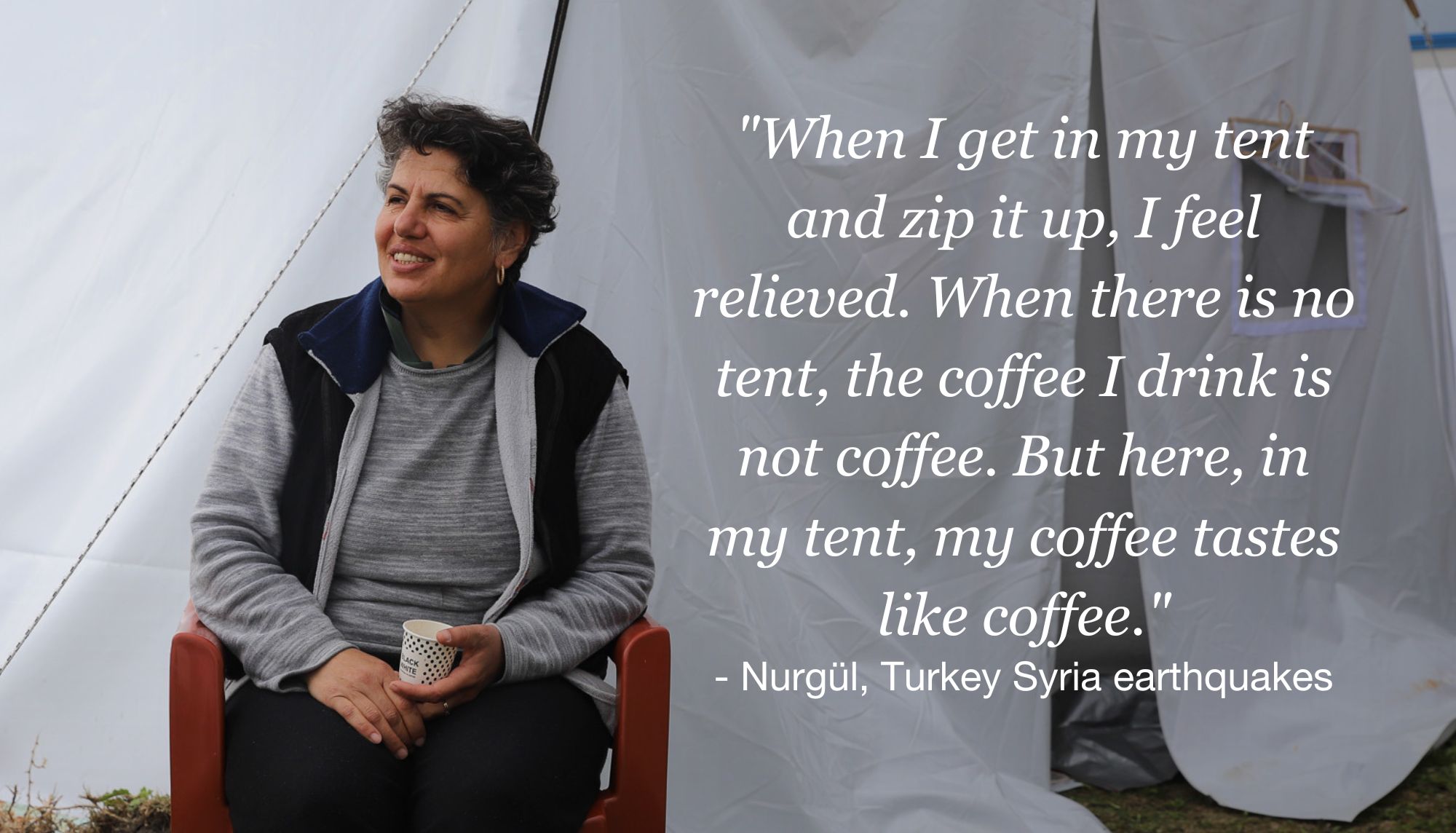 nurgul in front of her tent sipping coffee.